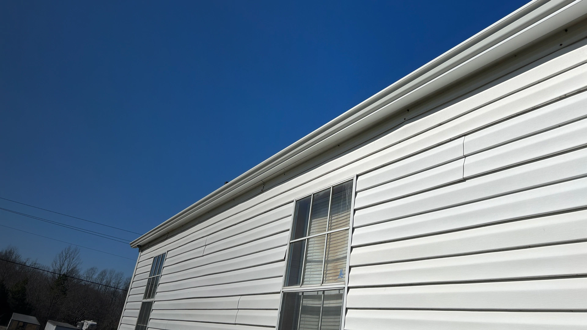 house with gutter and siding installation